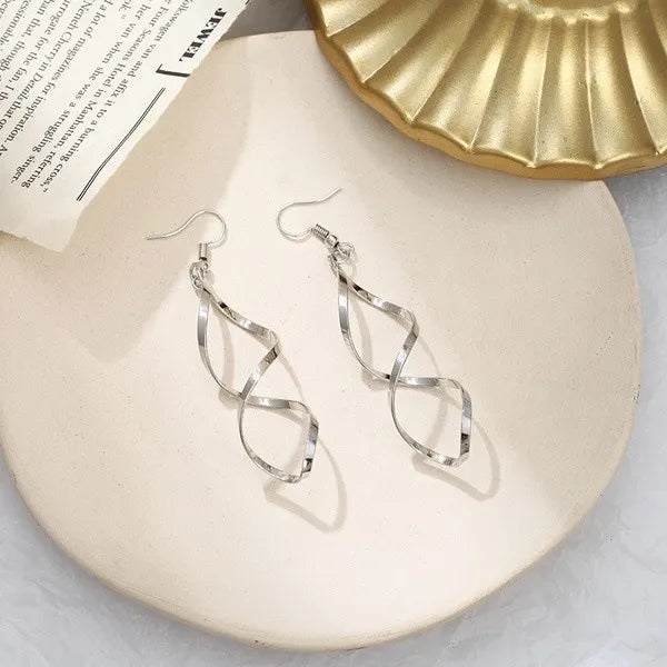 twist of faith earrings 8899